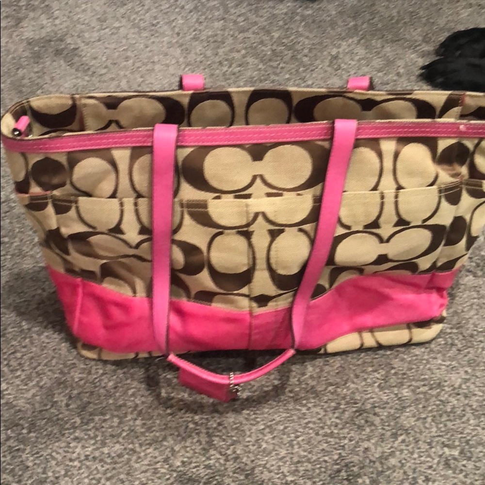 Pink and brown Coach diaper bag